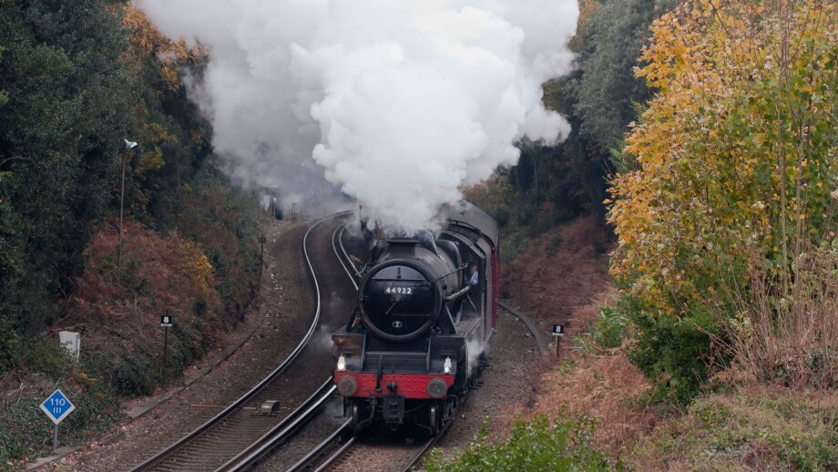 Steam Train under full power, approaching Bournemouth on the Weymouth to Waterloo Line, Dorset, England, UK.. Image shot 2010. Exact date unknown.