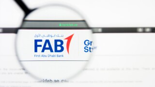 Los Angeles, California, USA - 5 April 2019: Illustrative Editorial of First Abu Dhabi Bank website homepage. First Abu Dhabi Bank logo visible on display screen.