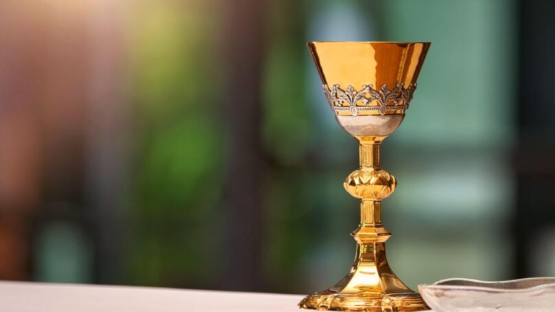 Chalice on the altar in church and empty space for text