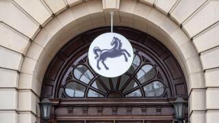 Lloyds Bank black horse logo framed by a classical doorway, Northampton, UK