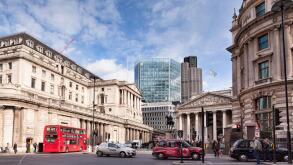 A street scene in Threadneedle Street, London, England, with the Bank of England on the left. The glass building is the...