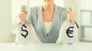 close up of woman hands holding money bags