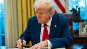 United States President Donald Trump signs two executive orders in the Oval Office of the White House in Washington, DC on Thursday, January 30, 2025. The first order formally commissioned Christopher Rocheleau as deputy administrator of the FAA. The seco