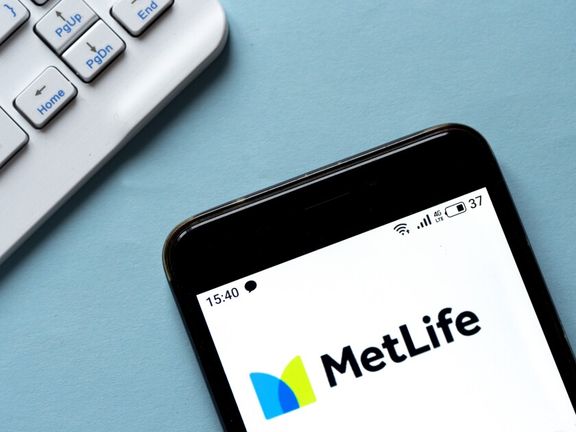 In this photo illustration MetLife logo is seen displayed on a s