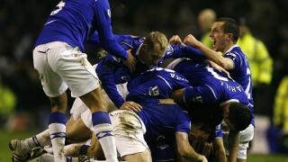 Everton players pile on top of goalscorer Dan Gosling after he scores his sides first goal of the game