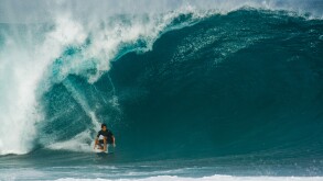Surfer riding huge wave, Bonzai Pipeline, North Shore, Oahu, Hawaii