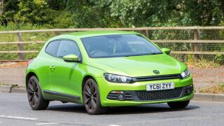 Milton Keynes,UK - June 18th 2023: 2011 green VOLKSWAGEN SCIROCCO GT car travelling on an English road
