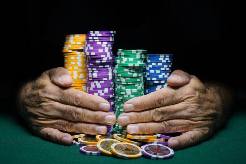 Montreal,Canada,14 October, 2018.Hands holding stacks of casino gambling chips.Credit:Mario Beauregard/Alamy Live News