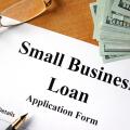 Small business loan form on a wooden table.