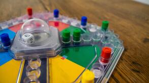 Durham, UK - 5 April 2020: Frustration (also known as Trouble and  Kimble) is a family fun board game  in which players compete to be the first to sen