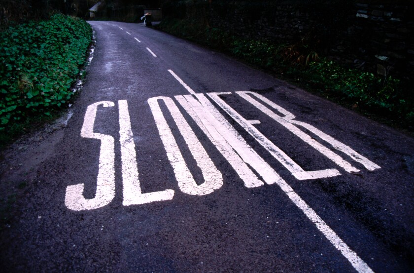 Slower Road Sign