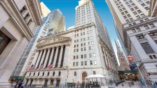 A view of Wall Street and New York Stock Exchange on a sunny day in New York, USA