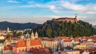 A picture of Ljubljana overlooked by the Ljubljana Castle at sunset.