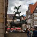 Bremen, Germany - July 16, 2022 : many tourist taking a photo at statue of Town Musicians of Bremen