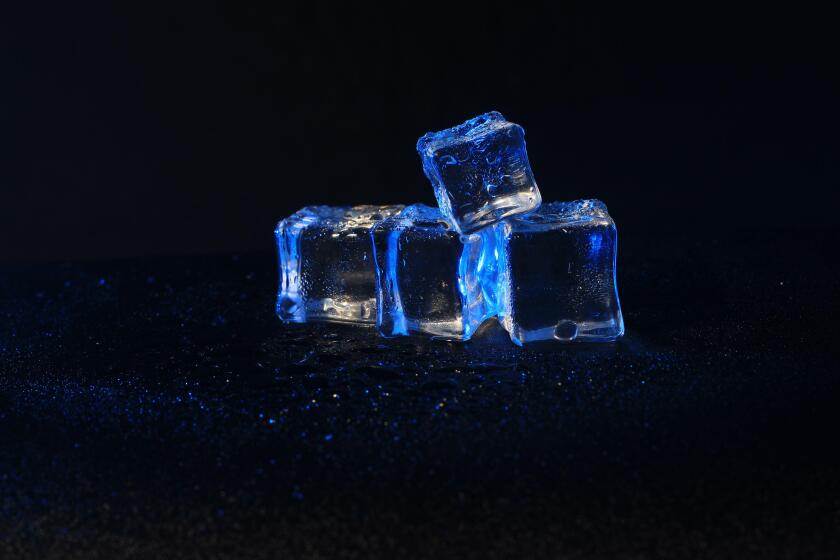 5 wet artificial or Blue fake ice cube at Black background
