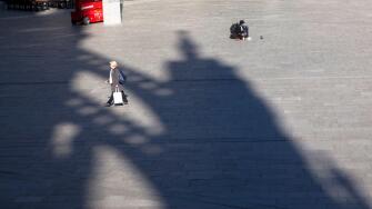 Coronavirus / Covid 19 outbreak, March 24th. 2020. Only few people on the square in front of Cologne central station, shadow of the cathedral, Germany