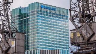 Barclays Head Office Canary Wharf London Docklands framed by old dockland cranes. Architects HOK International, Opened 2005.
