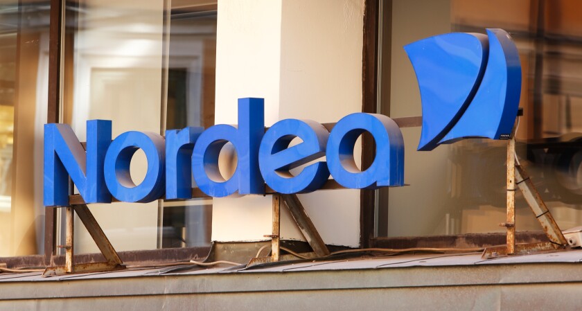 Stockholm, Sweden - August 2, 2013: Closeup of the Nordea bank office sign above the entrance at the office in downtown Stockholm.