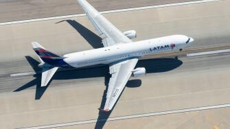 Aerial view of LATAM Airlines Boeing 767 CC-CXE departing LAX airport bound for Santiago (SCL), Chile. Widebody long haul aircraft seen from above.