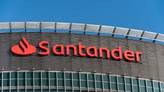 Santander Bank trademark, logo against blue sky on the top of  high class office complex located in the center of Poznan Financial Centre. Poland