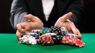 poker player with chips at casino table