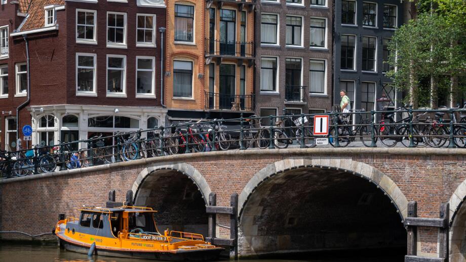 Amsterdam, The Netherlands - 21 June 2022: Old bridge in central Amsterdam