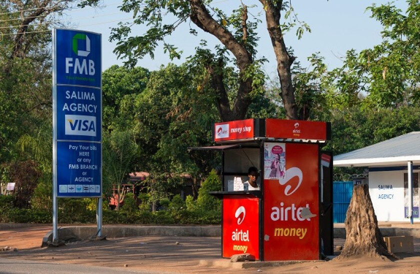 MALAWI, Salima, money transfer with airtel money, Airtel is an indian mobile phone company in contrast VISA advertisement of FMB Bank