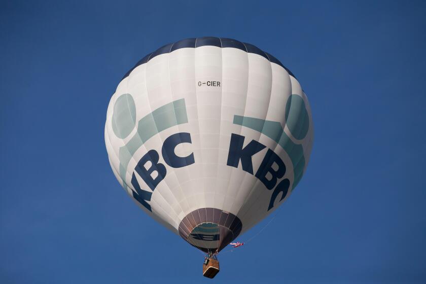 Bristol, UK. 8th August, 2015. KBC balloon lifts off at the Bristol International balloon fiesta 2015 evening Mass ascent. Credit: Keith Larby/Alamy Live News