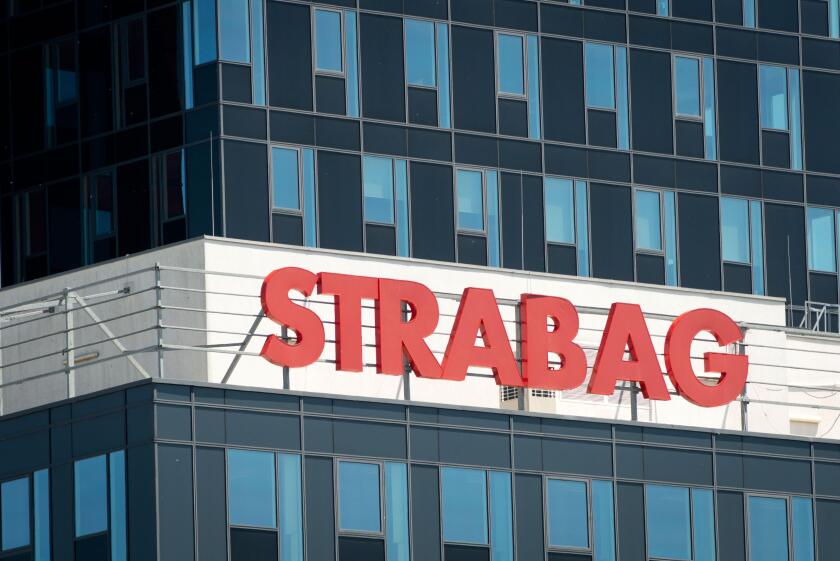 Strabag name plate red sign and logo on blue glass office building, Sofia Bulgaria, Eastern Europe, Balkans, EU
