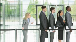 Business people waiting in line