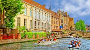 Tourist boats on the canals of Bruges, Belgium.