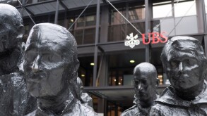 UBS headquarters at Broadgate, London, with the striking 'Rush Hour' sculpture by George Segal prominently displayed in the foreground, London, UK