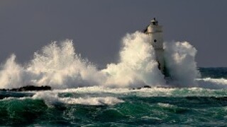 Lighthouse in storm from alamy 230x150