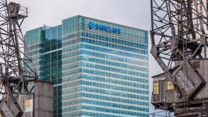 Barclays Head Office Canary Wharf London Docklands framed by old dockland cranes. Architects HOK International, Opened 2005.