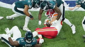 New Orleans, United States. 09th Feb, 2025. Kansas City Chiefs tight end Travis Kelce (87) is tackled by the the Philadelphia Eagles defense after a short gain in the fourth quarter in Super Bowl LIX at Caesars Superdome in New Orleans on Sunday, February