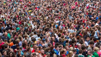 Crowd, many people in confined space, at a festival,