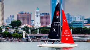 Sailing At The Bay, A DBS Sailboat Sails In Front Of The Merlion Park Area, Singapore, South East Asia