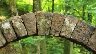 keystone of the stone bridge in Schweinbachtal near Hirsau in the district of Calw.