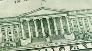 Macro close up of the US Treasury Building on the back of the US Ten Dollar Bill.