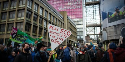 A group of climate protestors and activists march through George Square in Glasgow, showing that people do make Glasgow
