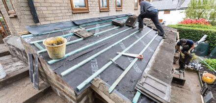 Building roofing house extension, Wales, UK