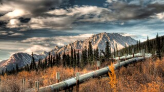 View of the Trans Alaska Pipeline winding next to Dalton Highway into the Brooks Range north of Sukapak Mountain, Alaska, HDR