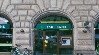 Bicycle parked by ATM Jyske Bank Copenhagen Denmark. Image shot 08/2009. Exact date unknown.