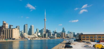 The Toronto skyline from the Billy Bishop Toronto City Airport overlooking the parking lot. Toronto, Ontario, Canada.