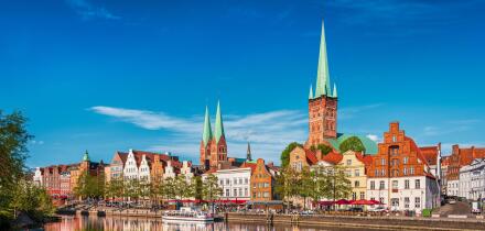 Historic skyline along the Trave river in the old town of Lubeck, Germany on a summer day
