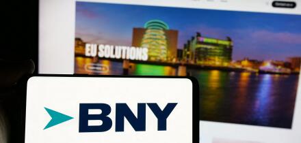 Stuttgart, Germany - 01-30-2025: Person holding smartphone with logo of company The Bank of New York Mellon Corporation (BNY) on screen