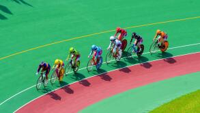 Female competitors in a "keirin" cycle race at Kyoto Keirin Racetrack in Mukomachi, Kyoto, Japan.