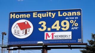 Billboard sign advertising home equity loans via Members 1st Federal Credit Union.