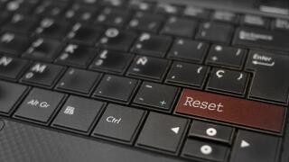 Reset concept. Reset key embedded in a computer keyboard