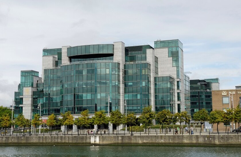 Modern building with glass facade of the AIB Bank in the financial district of Dublin, Ireland, Europe
